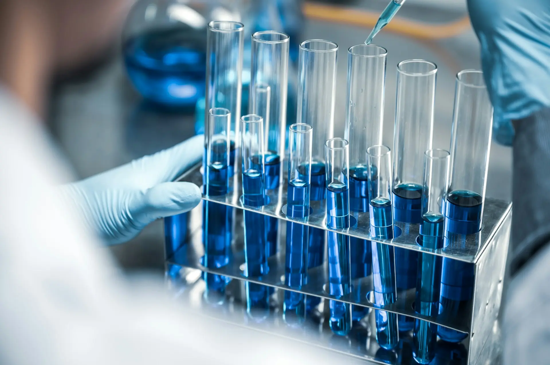 Drug stability testing in a laboratory with test tubes containing blue solutions