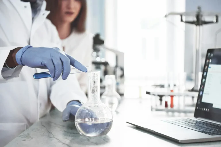 Lab technician testing pharmaceutical samples in a research laboratory